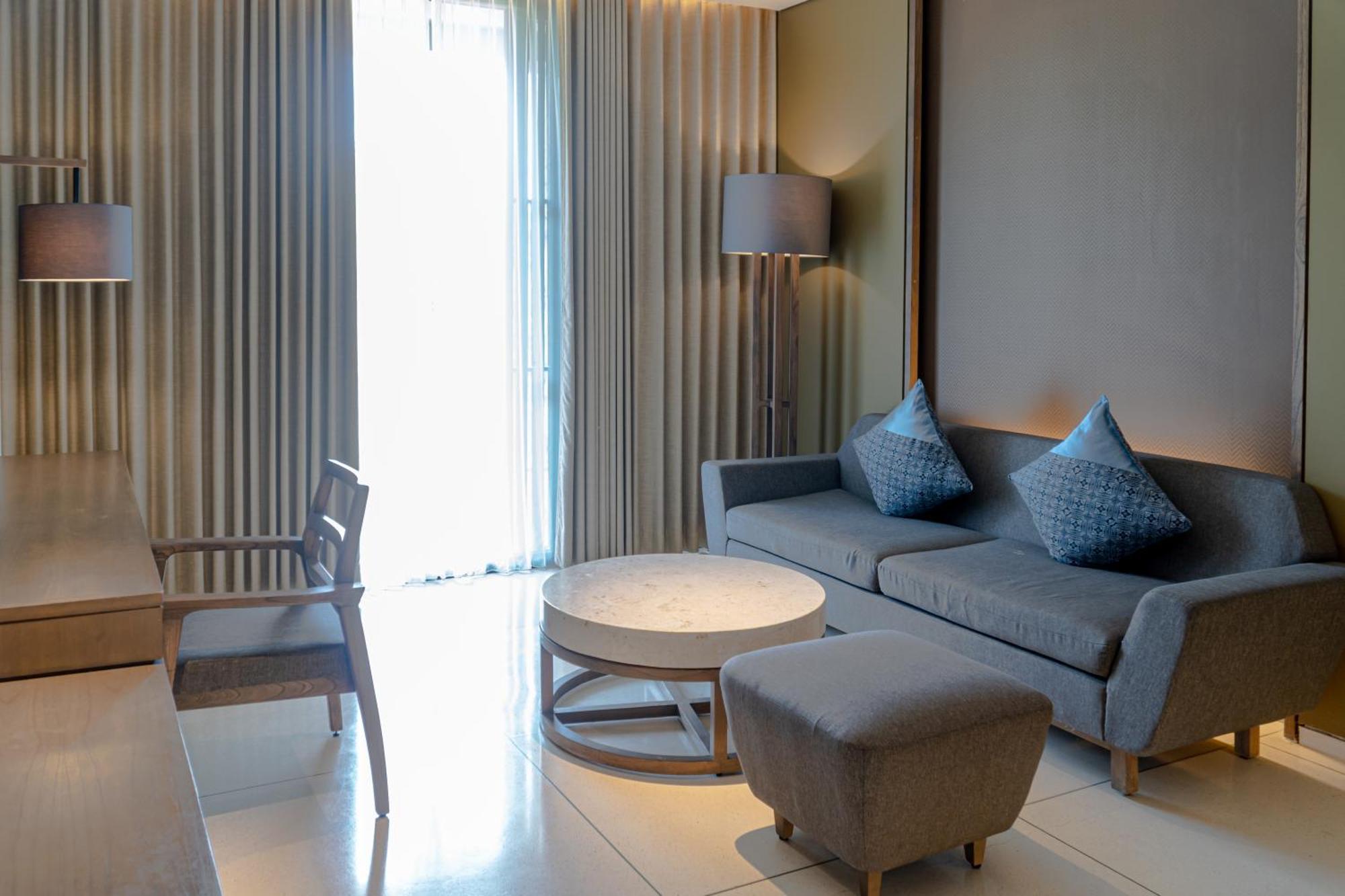 Wyndham Tamansari Jivva Resort Bali Siyut Ngoại thất bức ảnh A living room at the hotel