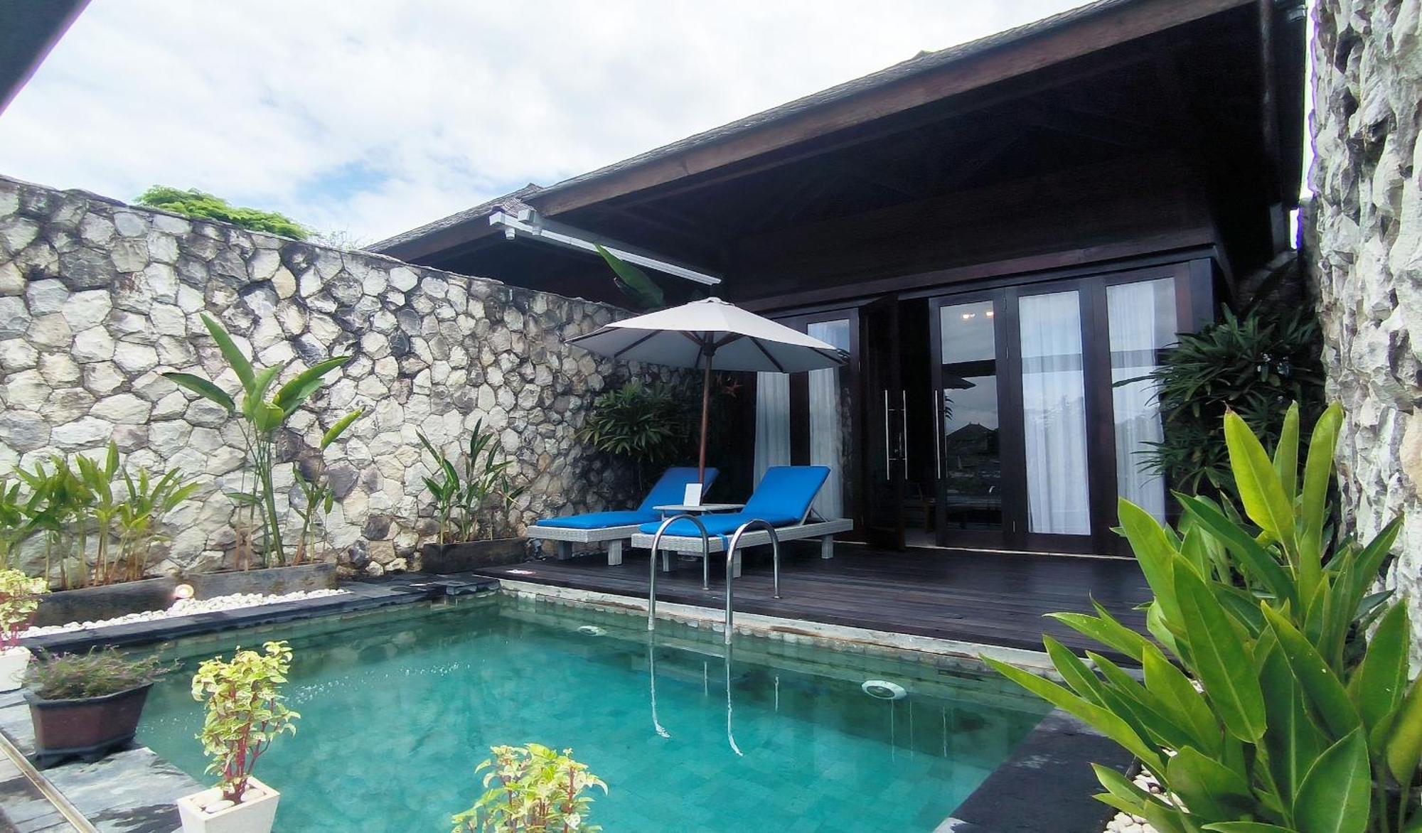 Wyndham Tamansari Jivva Resort Bali Siyut Ngoại thất bức ảnh A pool villa at the resort